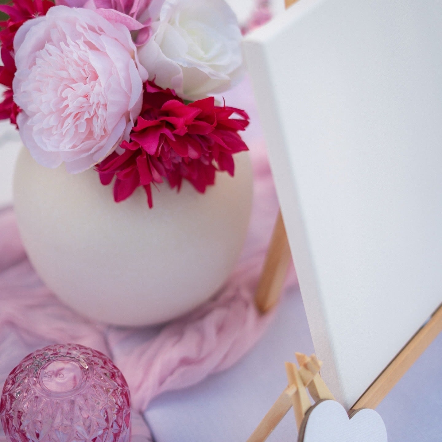 Decorative item with pink and white flowers on a white background